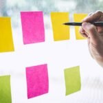 Businessman use post it notes to planning idea and business marketing strategy